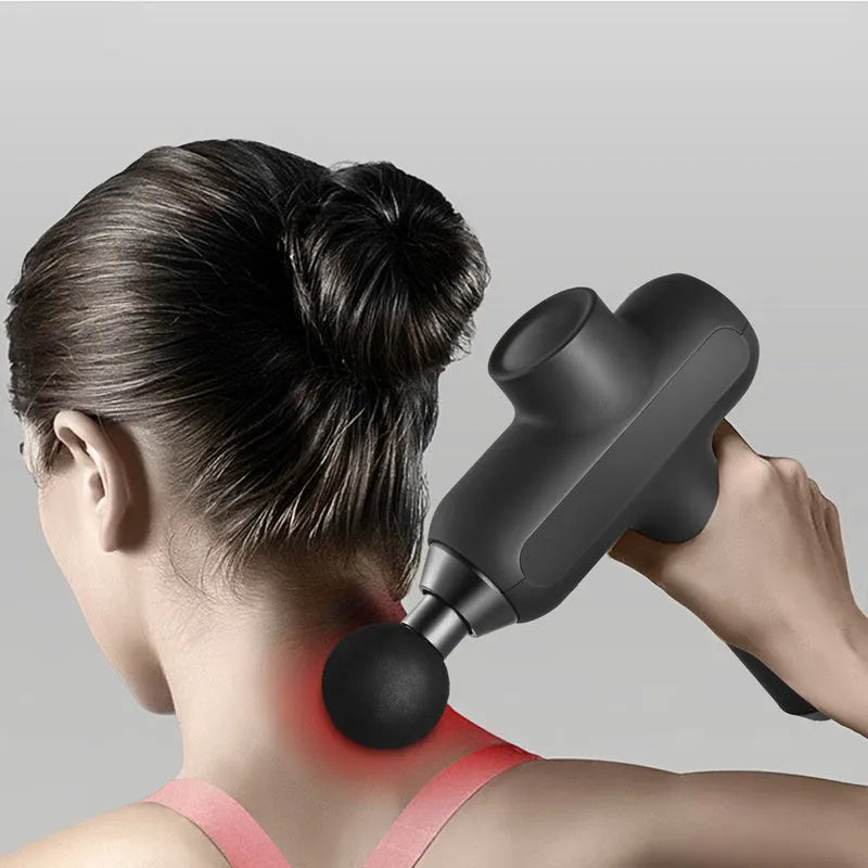 Portable muscle massager with six different massage heads on black background