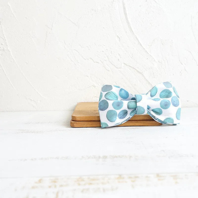 Polyester pet bow collar jewellery in bubble colour on a light background showing size options XS to XL