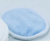 Set of red and blue velvet makeup remover pads in cotton mesh storage bag