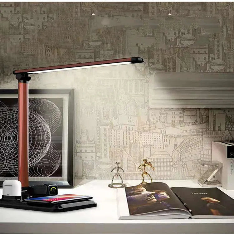 Black and white 4-in-1 LED desk lamp with wireless charging pad and USB Type-C port