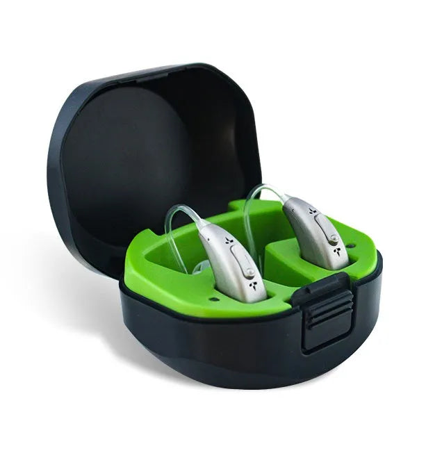 Invisible wireless hearing aid and its USB charging case on a table.