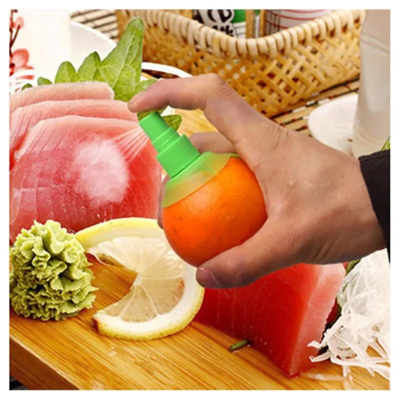 Green plastic lemon sprayer juice dispenser with screw-in nozzle on a white background