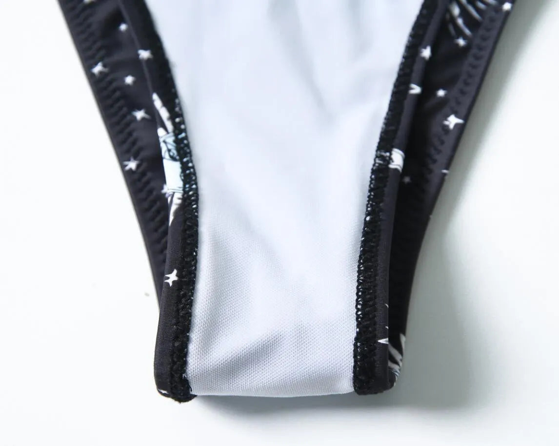 Black nylon one-piece swimsuit with backless design and waterproof print pattern