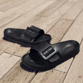 Women's grey blue flip-flop slippers with a buckle strap on a soft EVA sole.