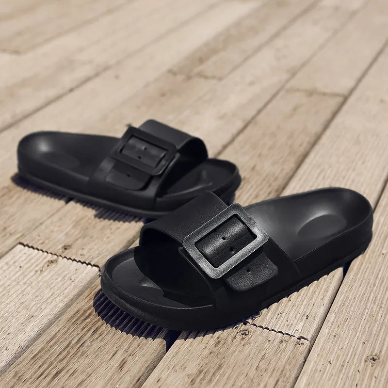 Women's grey blue flip-flop slippers with a buckle strap on a soft EVA sole.