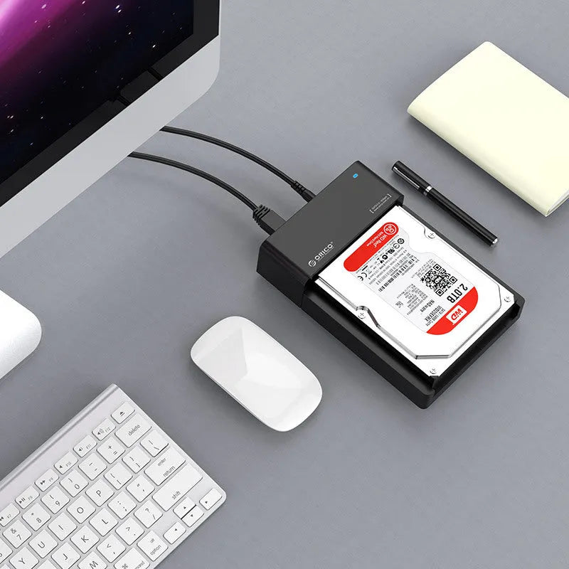 Black universal hard drive enclosure for 2.5 inch and 3.5 inch SATA drives with data cable