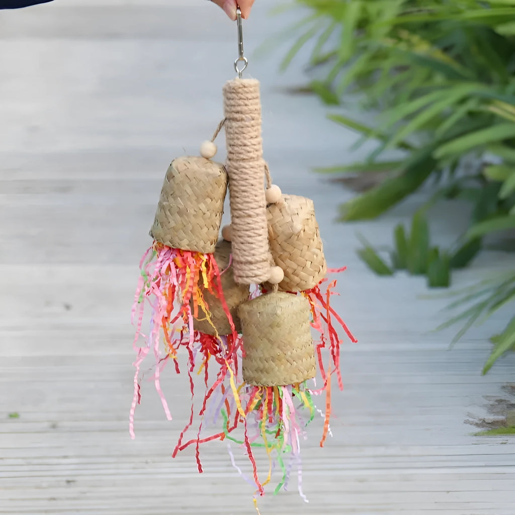 Wood and sisal parrot toy with colourful shredded paper centre for biting and foraging.