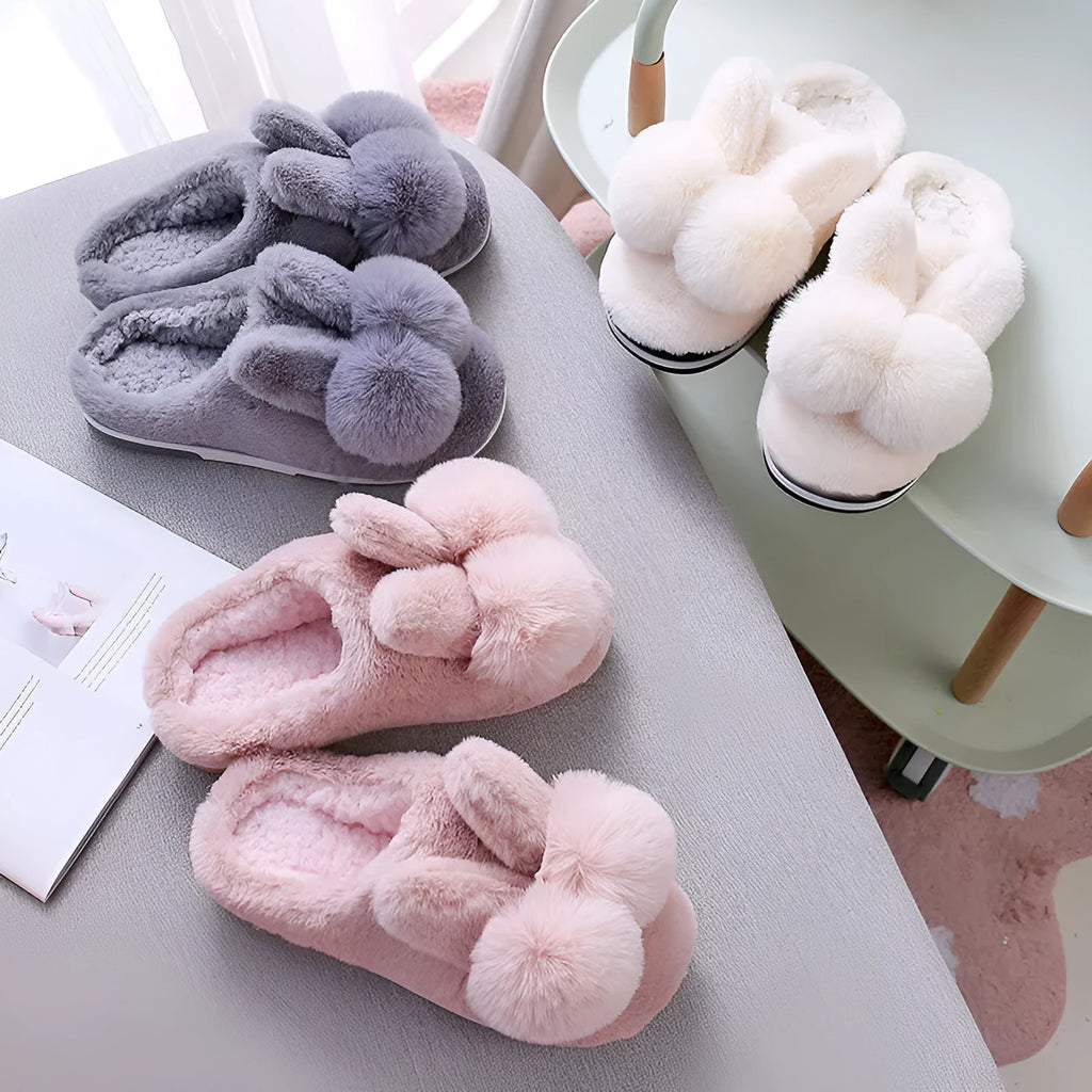 Women's high-top rabbit fur slippers in creamy white colour with floral detail.