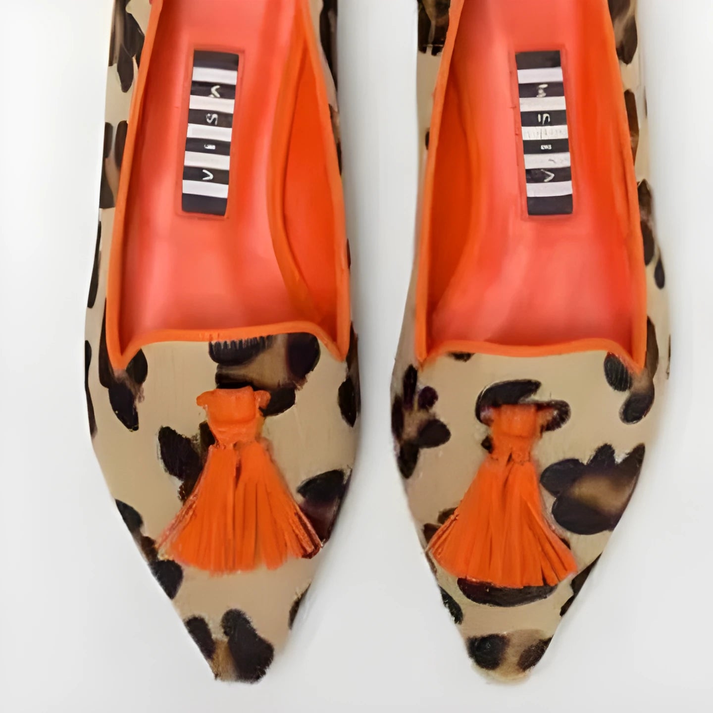 Women's low-cut pointed-toe colourblock tassel flat shoes in Brown Green and Brown Orange on a clean background