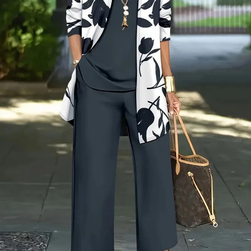 Women's blue Japanese Korean style three-piece suit comprising a long sleeve coat, vest, and trousers.