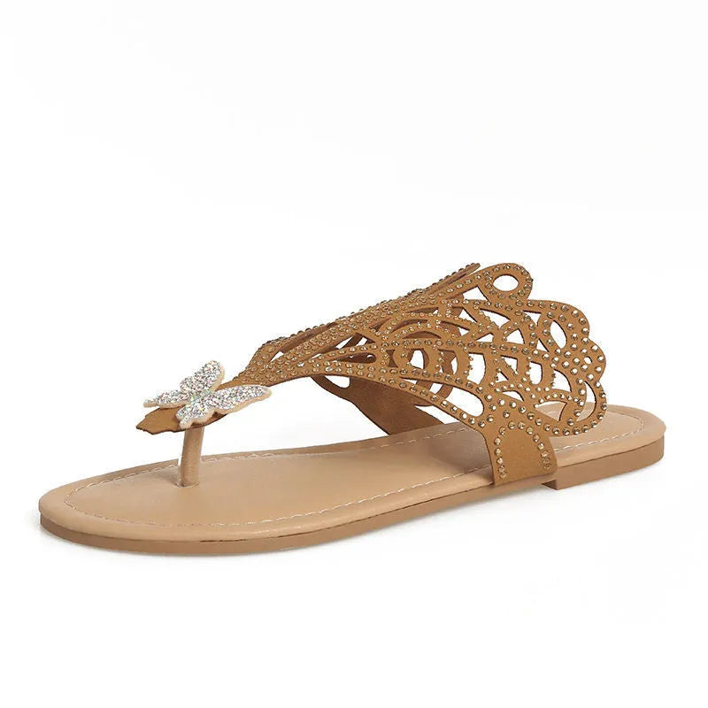 Women's black slip-on sandals with rhinestone details and a flip-toe design