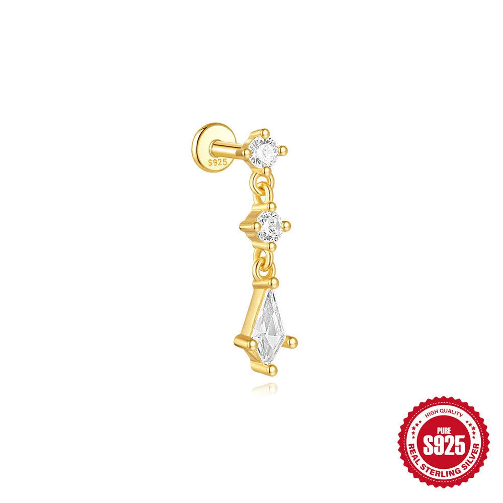 Geometric kite-shaped sterling silver earring with rhinestone head and gold chain tassel.