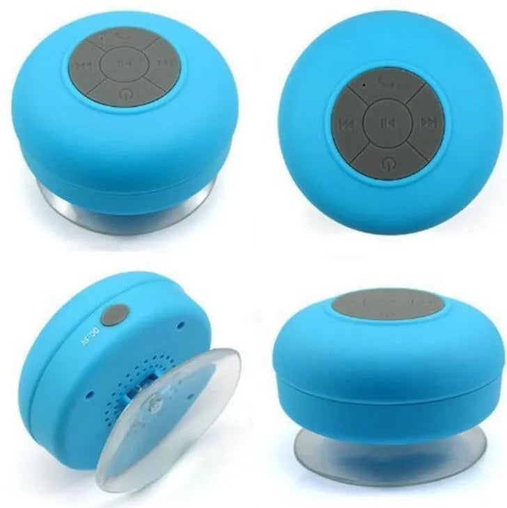 Portable Bluetooth speaker with suction cup showing front speaker grille and side buttons