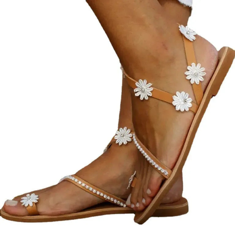 Brown ladies flat sole Roman sandals with floral pattern and elastic sleeves