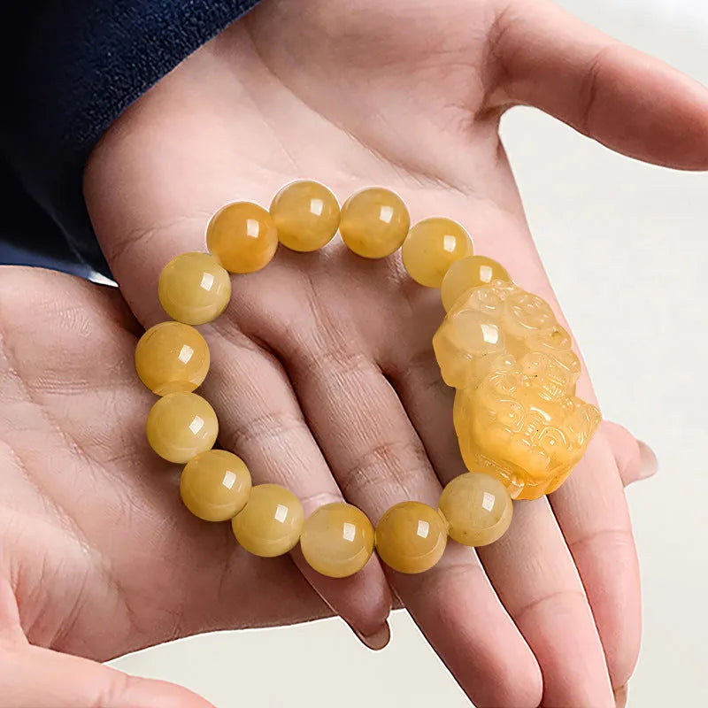 Jade money bracelet showing carved Jinsi Jade stone with beads in Golden Thread Jade colour