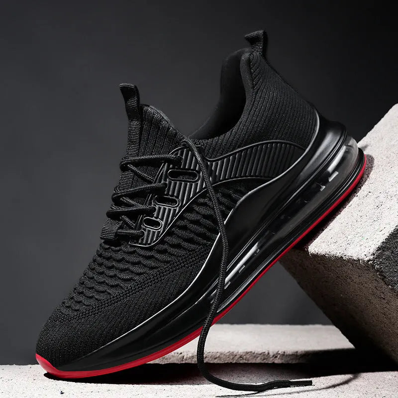 Men's black mesh running shoes with platform sole and round toe design on white background