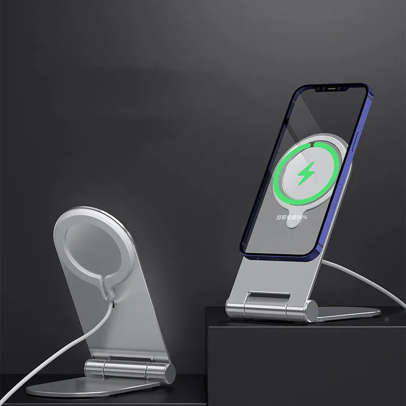 Silver vertical adjustable magnetic phone bracket for iPhone 12 on a flat surface.