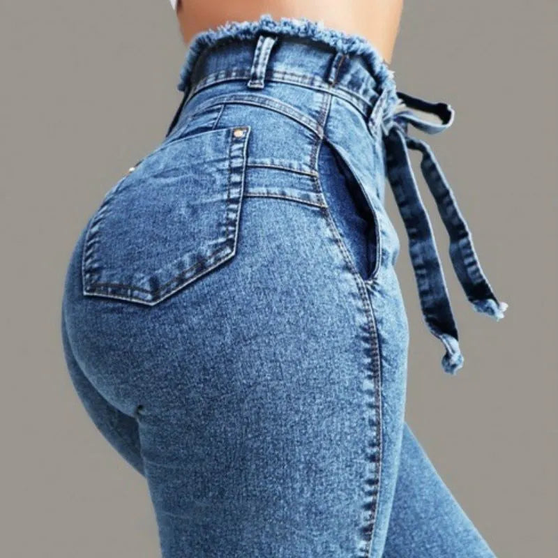 Pair of straight-leg jeans with a frayed fringed hem detail, shown in light blue denim.