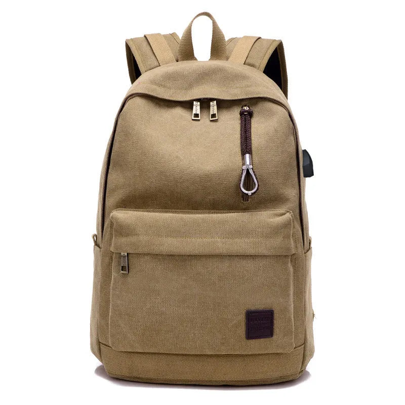 Canvas USB rechargeable backpack in grey showing front pocket and shoulder strap