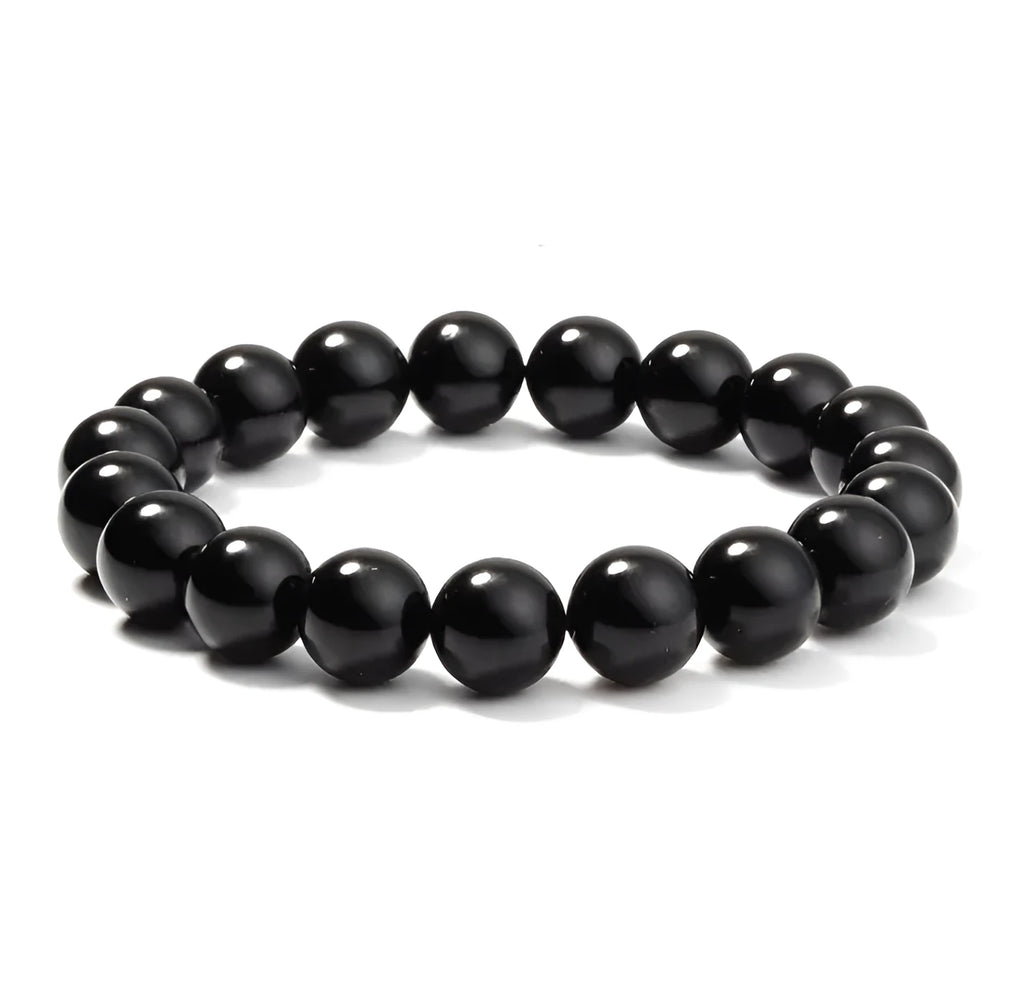 Geometric black onyx bracelet with 8mm beads on a black elastic cord.