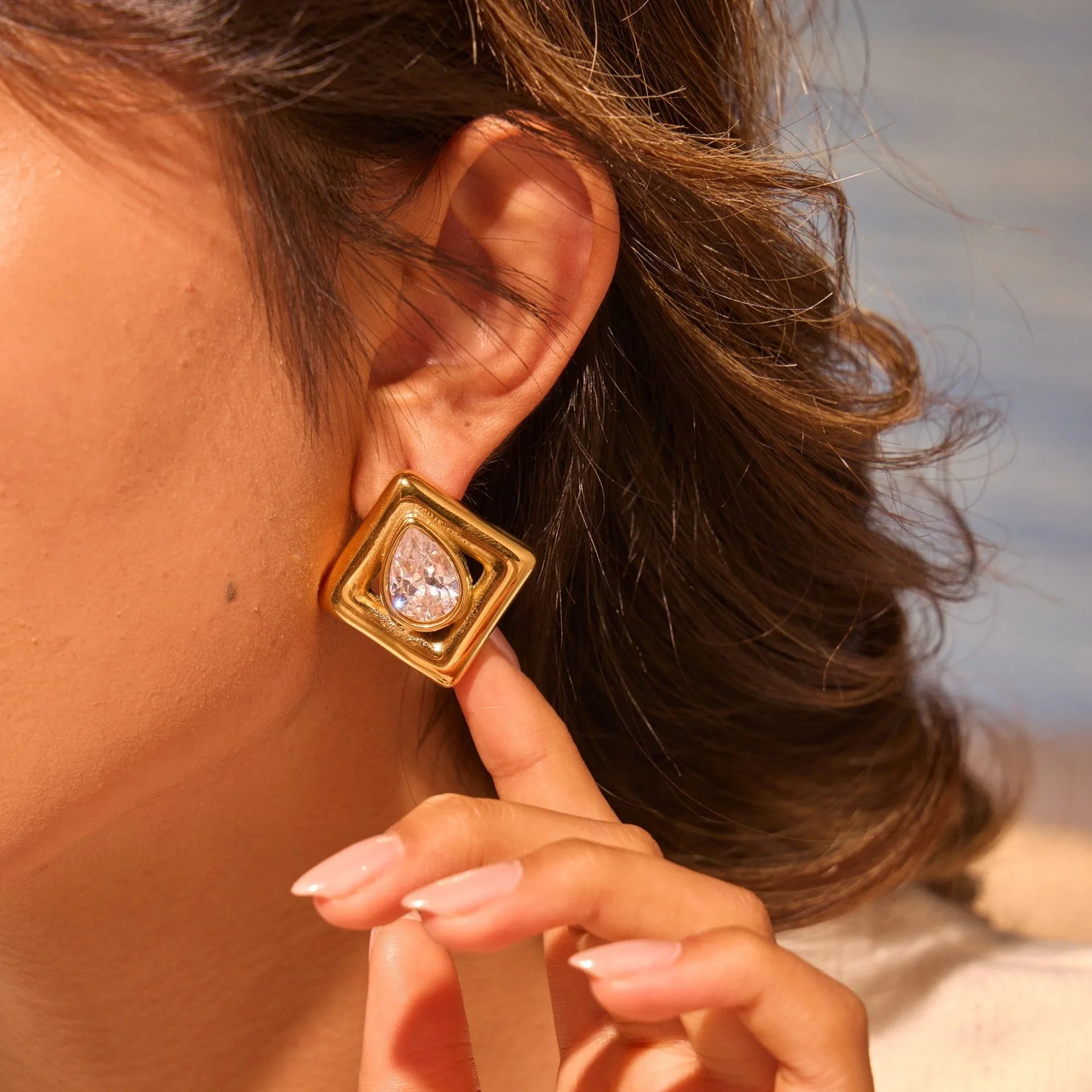 Gold geometric water drop zircon stud earrings with butterfly back fastenings