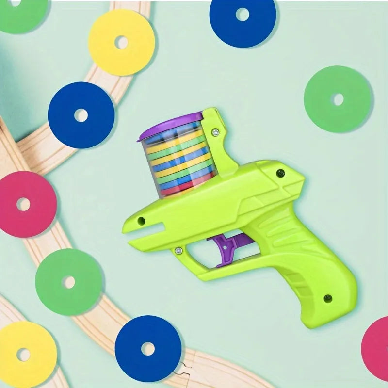 Green interactive cat toy launcher with three white foam discs on a carpet.