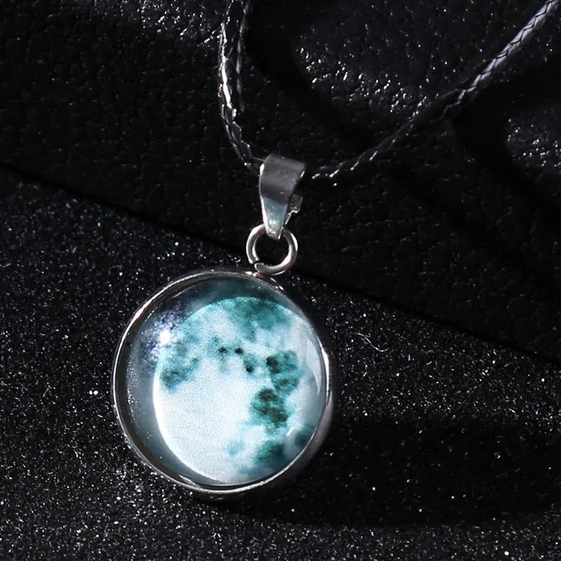Luminous moon and constellation design pendant on an alloy necklace chain with extension.