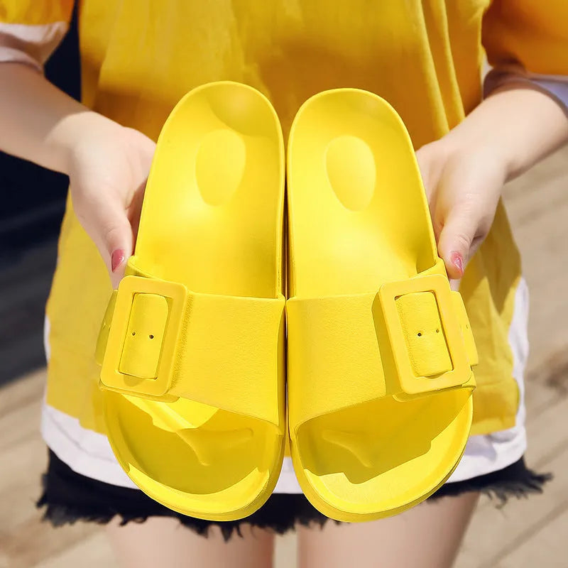 Women's grey blue flip-flop slippers with a buckle strap on a soft EVA sole.