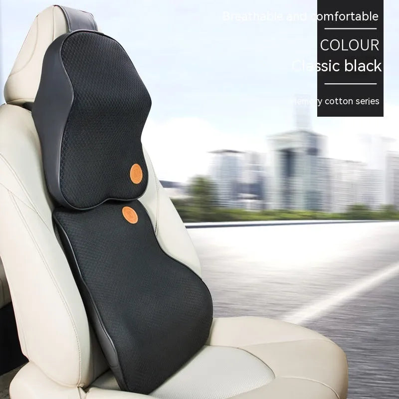 Black and brown memory foam car headrest pillow and lumbar support cushion set on a car seat.