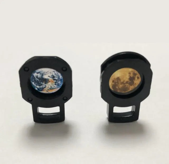 Star projector lamp showing earth projection on wall with adjustable rotating bracket and USB cable