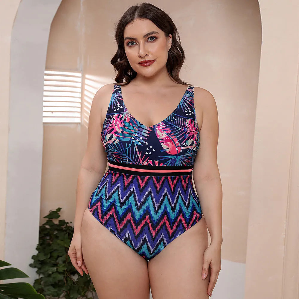 Blue striped one-piece swimsuit with spaghetti straps for women on a mannequin.