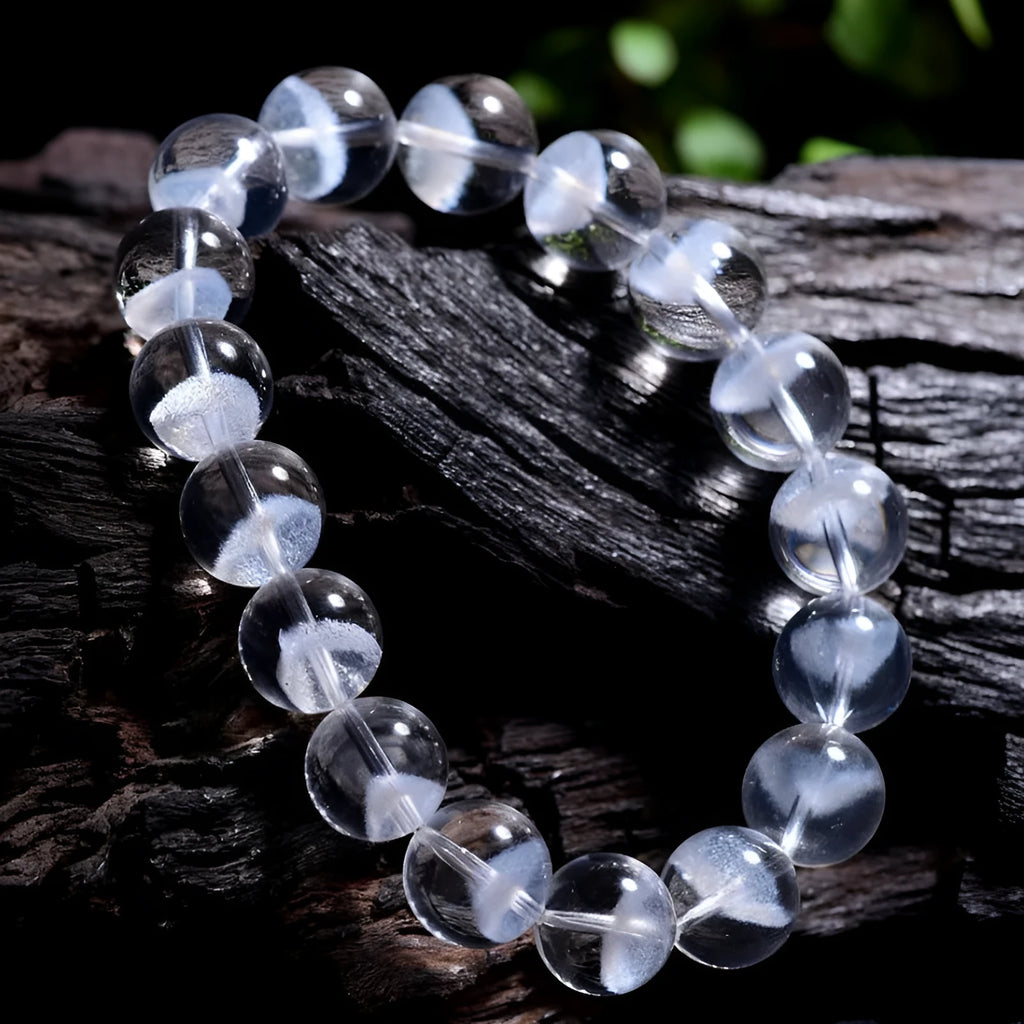 Women's white crystal pyramid bracelet with traditional Ruyi element design showing multiple bead sizes