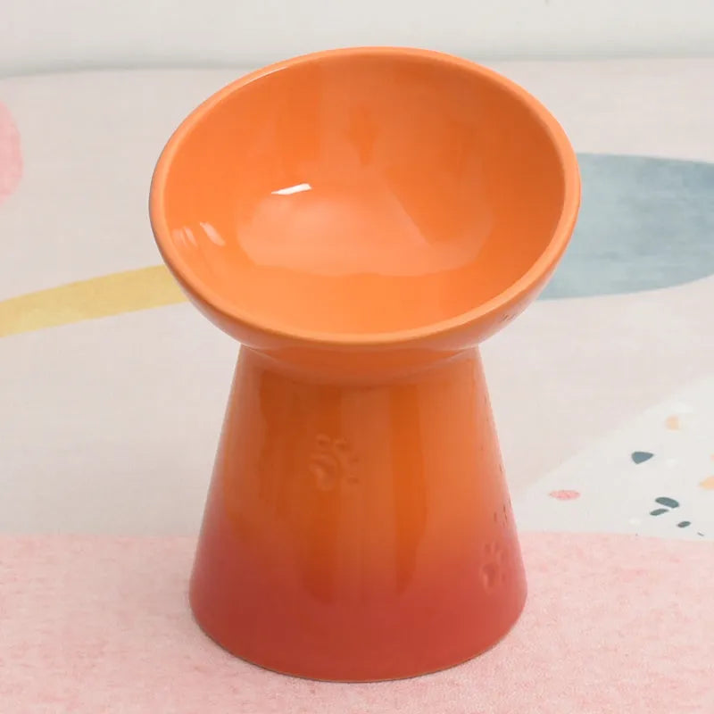 A white ceramic pet bowl with a high foot and raised neck protector to prevent tipping.