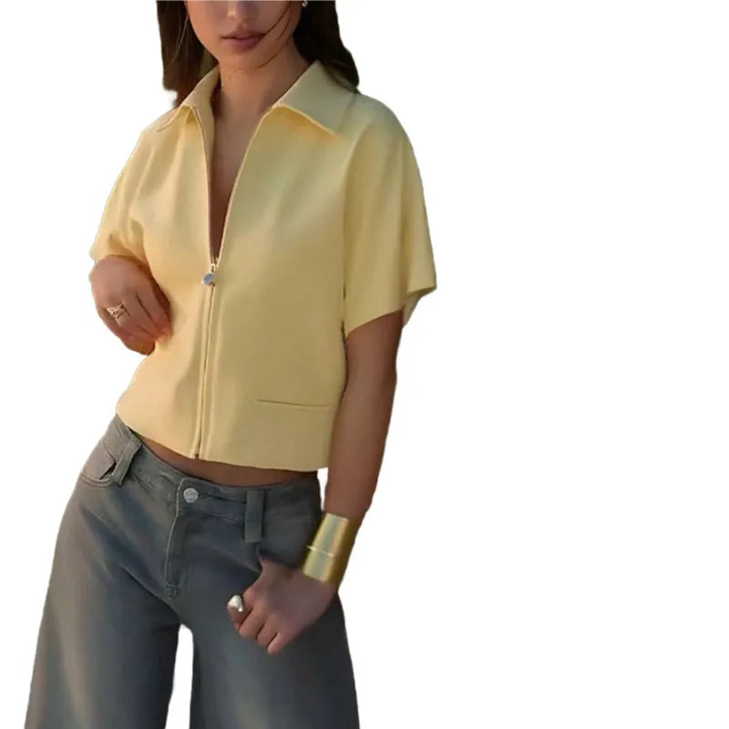 White loose-fit casual Damascus polyester top with short sleeves on a hanger.