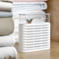 White reusable electric cabinet dehumidifier with transparent top showing orange silica gel crystals.
