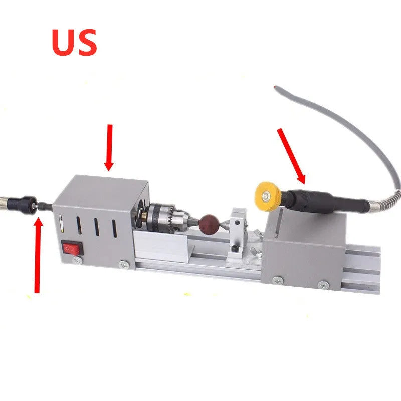 Silver metal mini manual woodworking lathe with carving knives on a workbench.