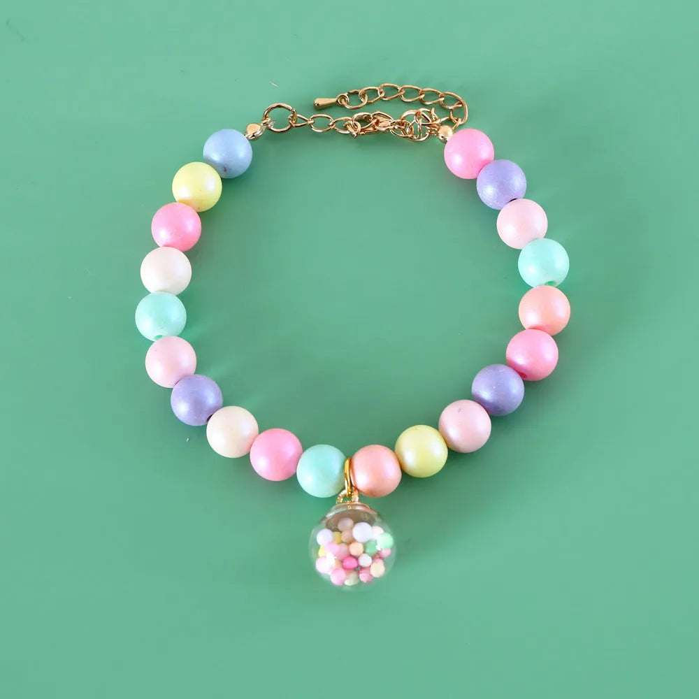 Colourful resin pet jewellery with moon and meteor motifs in macaron colours for dogs and cats