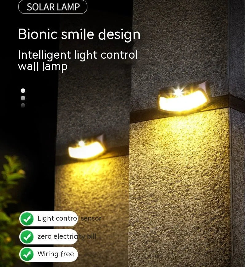 Solar-powered outdoor wall lamp with a smiling face design in warm or white light.