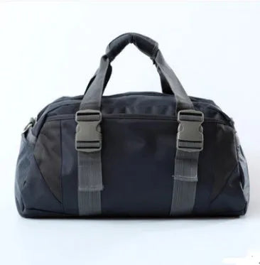 Black nylon yoga gym bag showing medium and large size options next to a yoga mat.