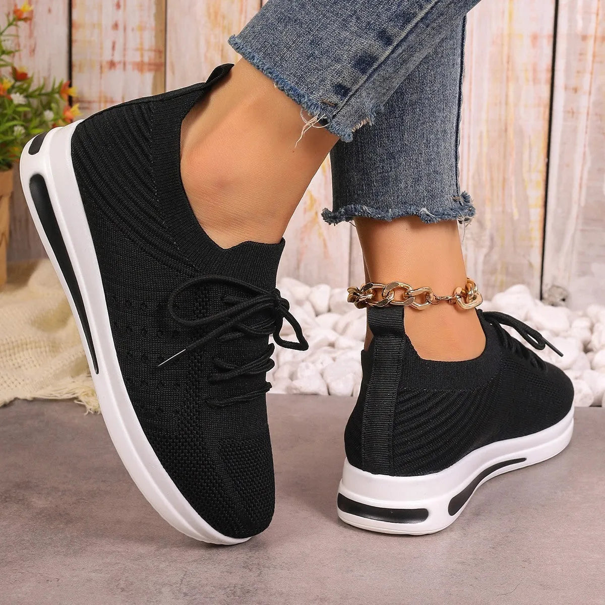 Women's low-top fly-knit sneakers in red colour with front lace-up closure and round-toe design