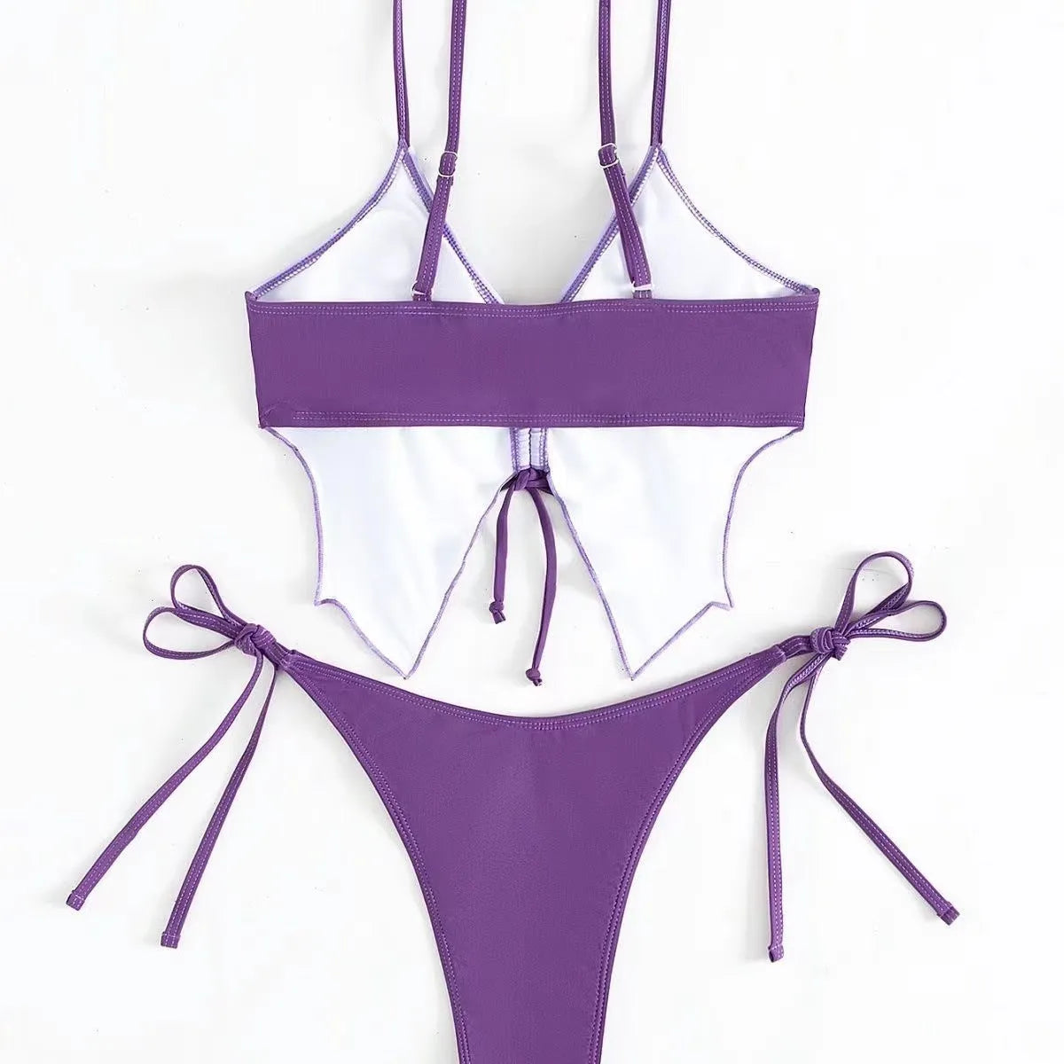 Women's purple bow style split bikini swimsuit with sleeveless top and briefs.