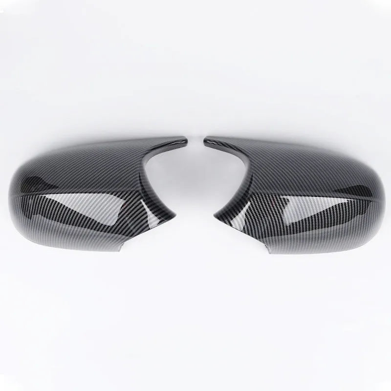 Pair of black ABS plastic rearview mirror housings for BMW 3 Series E90 model.