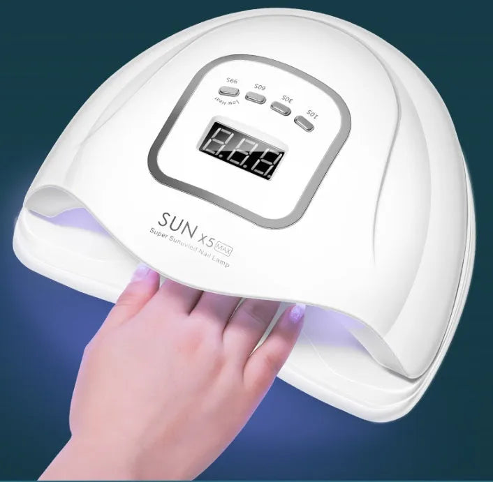 White nail polish dryer lamp with UV and LED light beads and digital timer display.