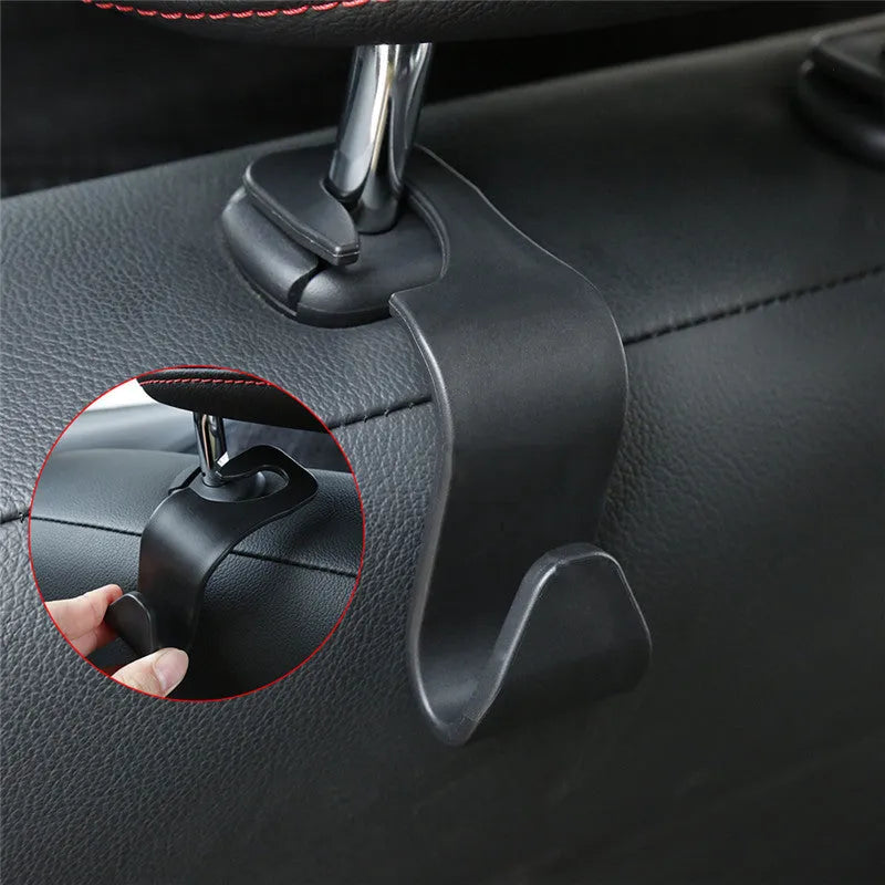 Set of 4 black PP universal car seat back hooks, each 11cm x 3.5cm, with 20kg weight capacity, for hanging bags from car front seat backs