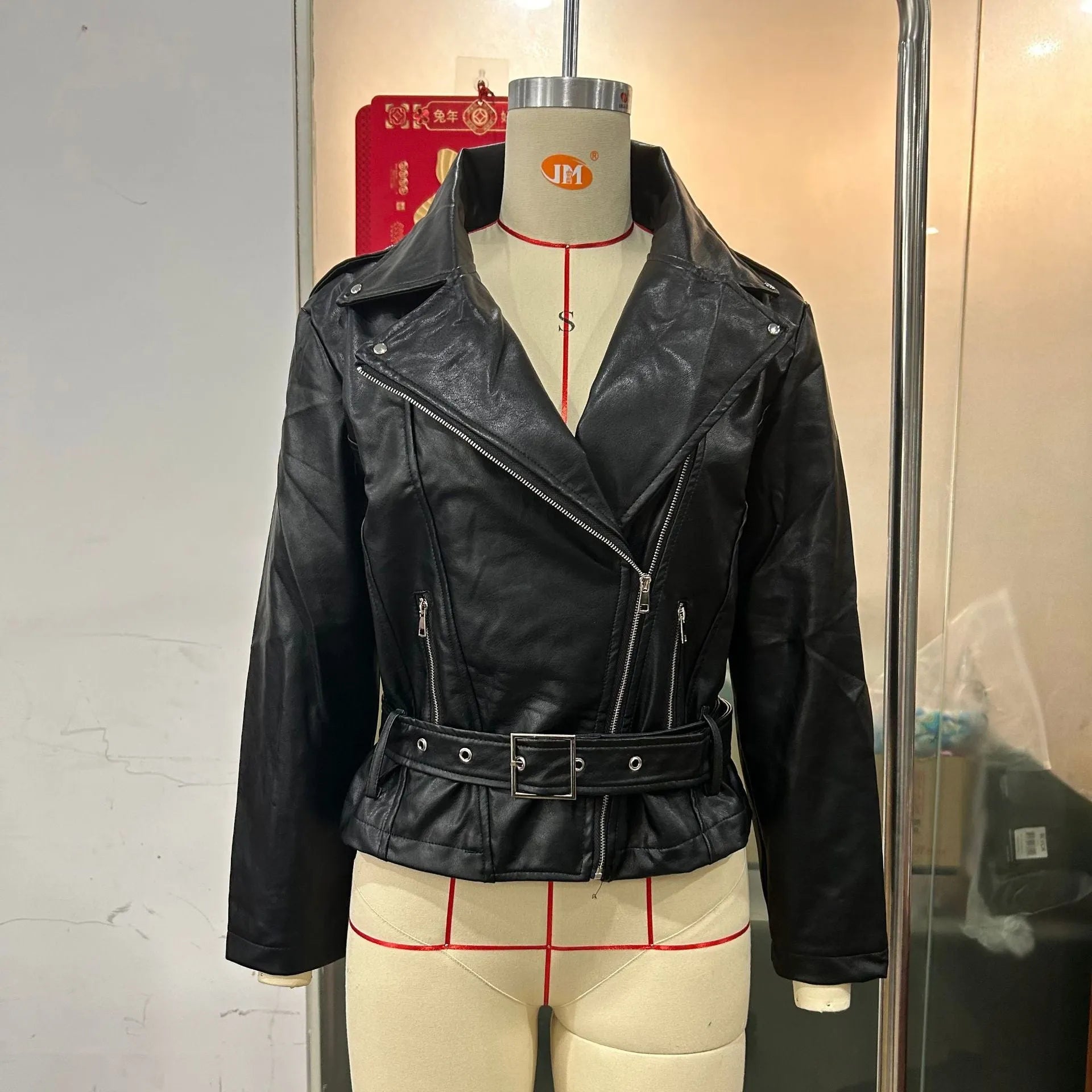 A black punk-style men's jacket with a locomotive shape, Peter Pan collar, and a drawstring waist.