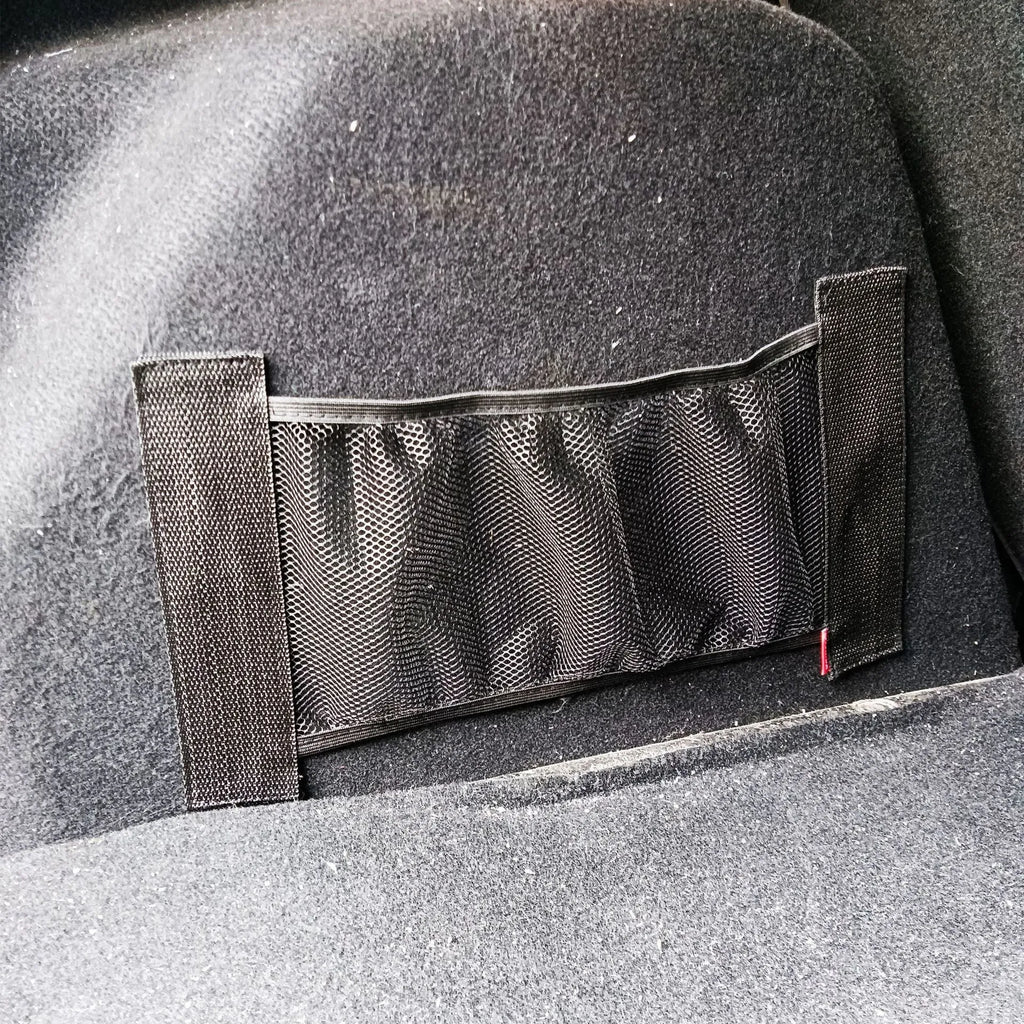 A close-up view of a black polyester elastic storage net stretched flat, showing its mesh design.
