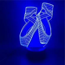 3D acrylic ballet shoe night light with colourful LED illumination on ABS base, remote control beside it