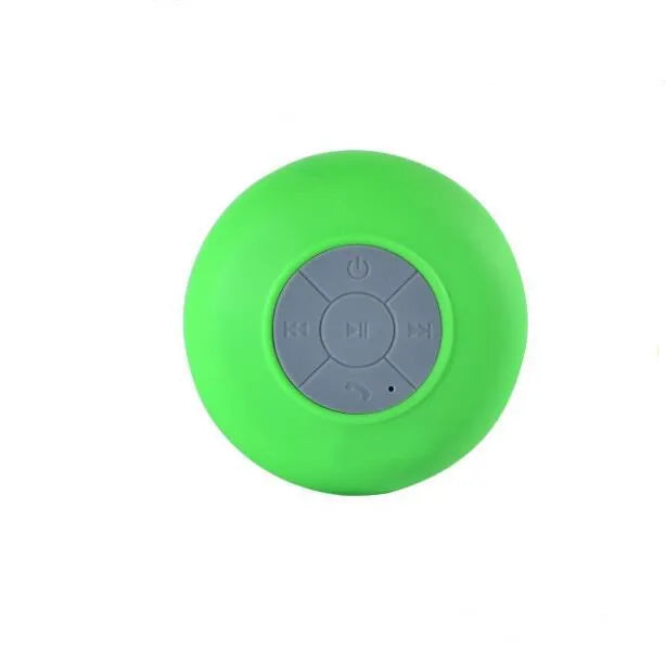 Portable Bluetooth speaker with suction cup showing front speaker grille and side buttons