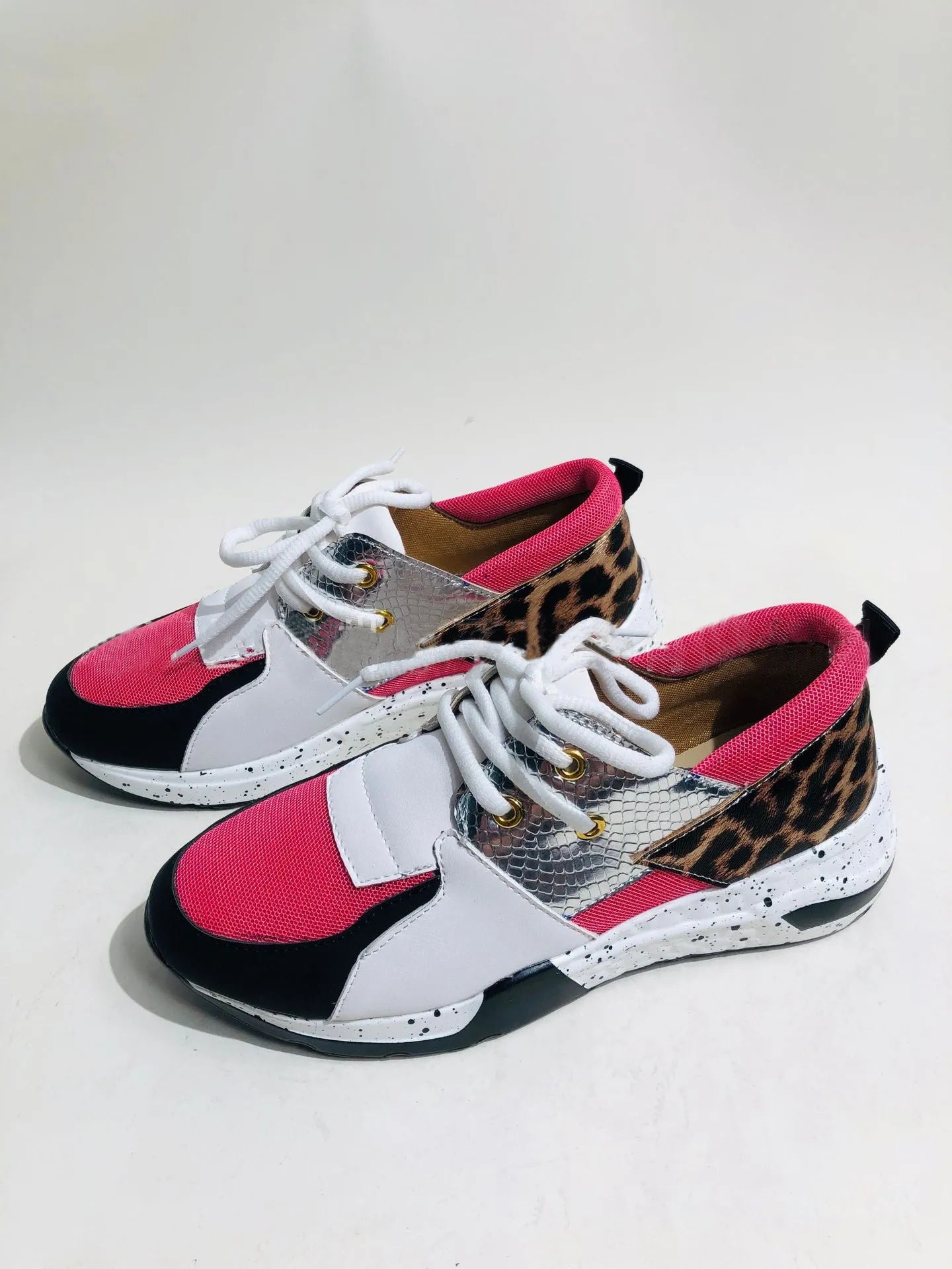 Women's casual suede sneakers with wedge heel in black, leopard, panther, pink, and snake pattern colours