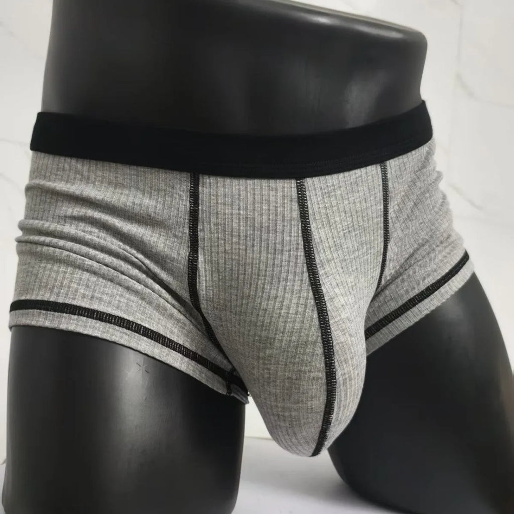 Men's thin fibre boxer shorts in army green, shown laid flat to display hip lift design.
